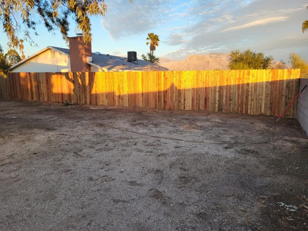 Custom wooden fencing upgrade with desert landscaping and Catalina Mountain backdrop – Kat Remodeling