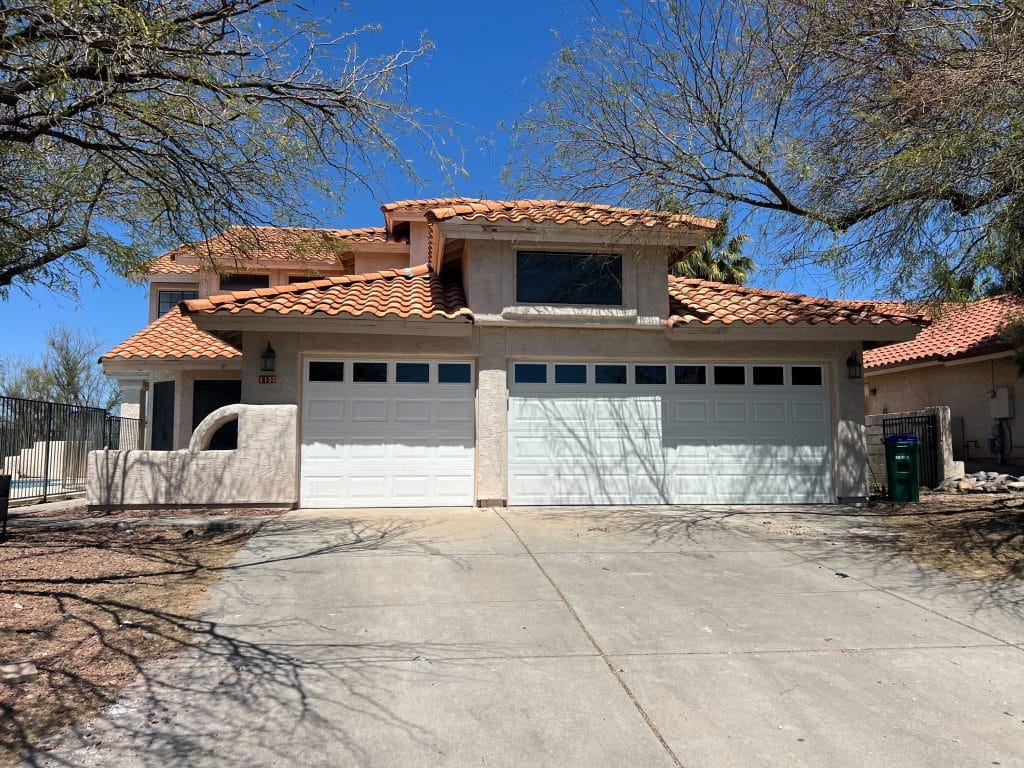 Exterior home update with new garage doors and stucco touch ups by Kat Remodeling in Tucson, Arizona