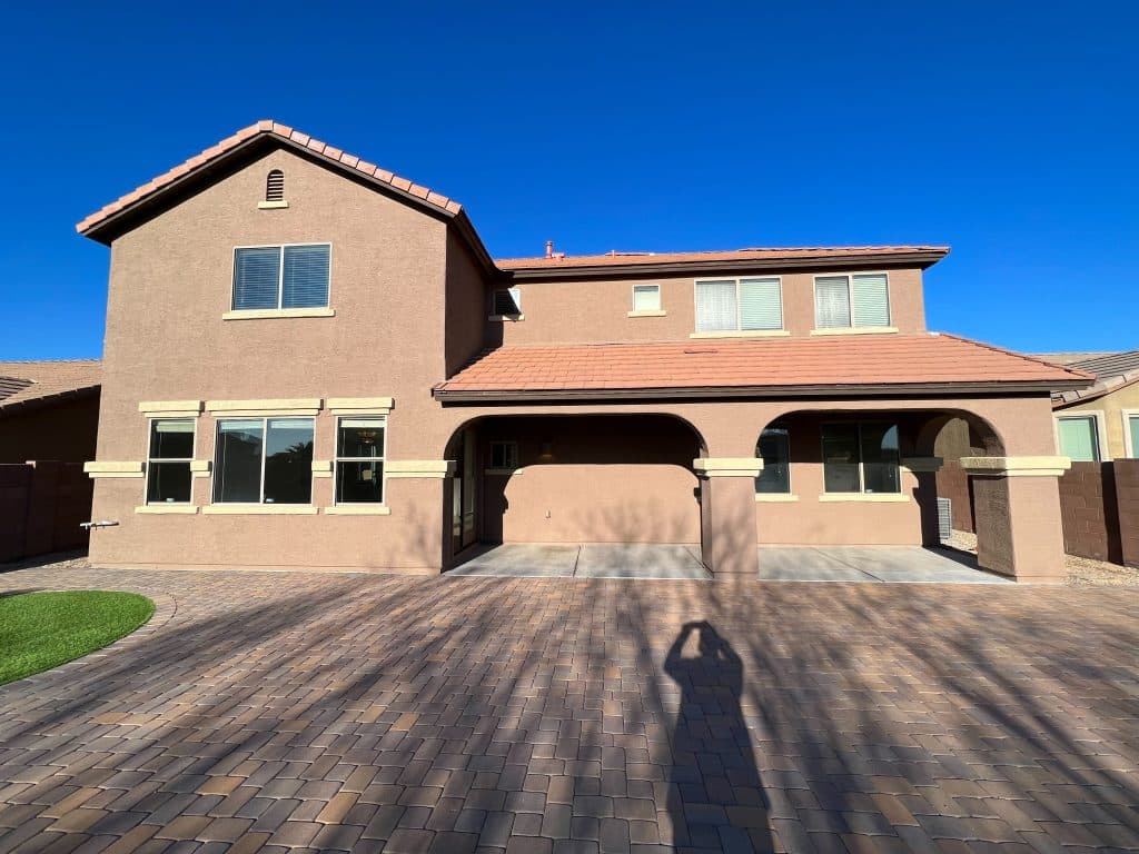 Full exterior home renovation with paved entryway and clean architectural details – Kat Remodeling, Southern AZ
