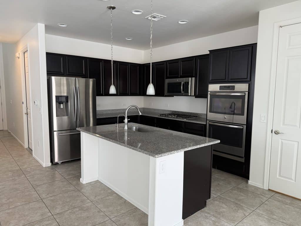 Sophisticated kitchen renovation featuring pendant lights and double ovens – completed by Kat Remodeling in Southern Arizona