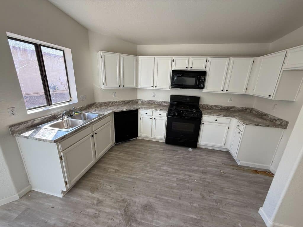 U shaped kitchen renovation with modern finishes and updated flooring – completed by Kat Remodeling